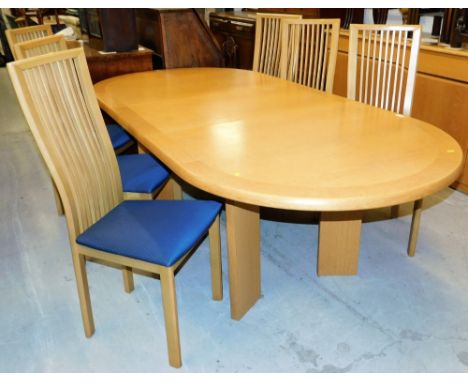 A Skovby Danish light oak dining table, with an oval top, the top 207cm x 105cm, and a set of six associated oak dining chair