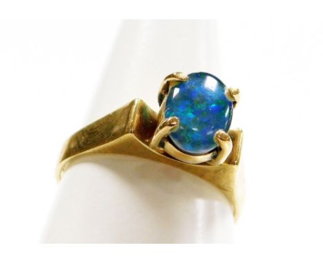 A 9ct gold opal dress ring, with single opal in four claw raised setting, stamped 9ct, ring size N, 3.1g all in.