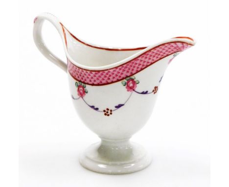 A late 18thC Newhall porcelain helmet shaped cream jug, pattern number 67, with scale border and rose swag design, circa 1780