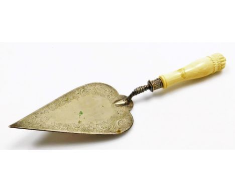 A late 19th/ early 20thC presentation trowel, the plated blade decorated with flowers, scrolls etc., with an ivory handle, 36