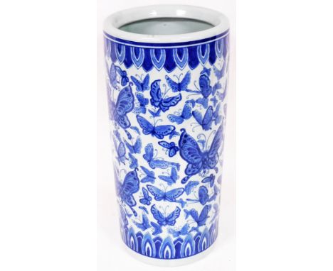 A 20thC blue and white Chinese porcelain stick barrel, of cylindrical form transfer printed with acanthus leaves and butterfl