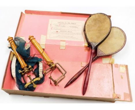 An early 20thC Gossima vintage childs ping pong game, partially boxed, with rackets, nets and other accessories, 46cm wide. (