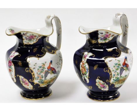 Two early 20thC Booths wash jugs, each in Scale Blue pattern with gilt detailing and Asiatic pheasants and leaves, 28cm high.