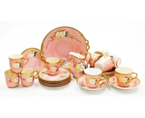 A 19thC porcelain part tea and coffee service, each piece on a pink ground decorated with flowers with gilt highlights, to in