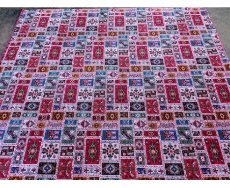 An Axminster type carpet, in Persian style, with compartments, 366cm x 430cm.  