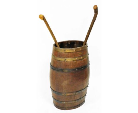 A 20thC stick barrel constructed from the teak of HMS Iron Duke, partially metal bound and of oval form, 62cm high, and vario