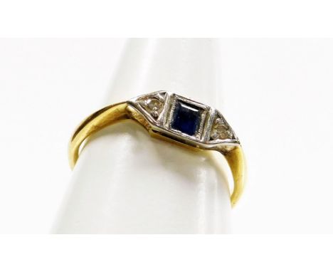 An Art Deco style dress ring, the central design set with square cut sapphire and two tiny diamonds, in illusion platinum set