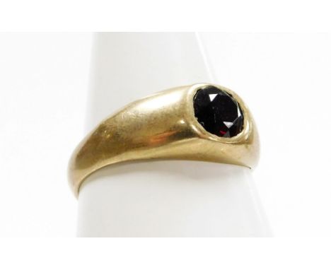 A 9ct gold dress ring, with central garnet in a rub over setting, ring size R, 3.5g all in. 