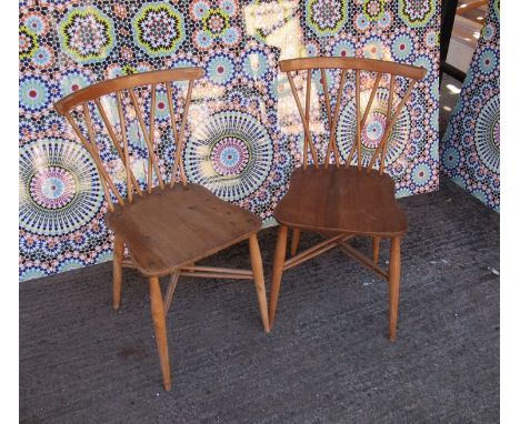 A pair of Ercol cross stickback dining chairs 