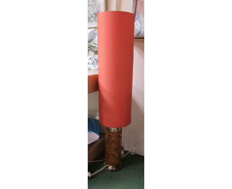 An orange and red shatterline resin floor lamp with orange shade 