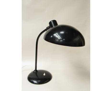 A black painted metal adjustable desk lamp