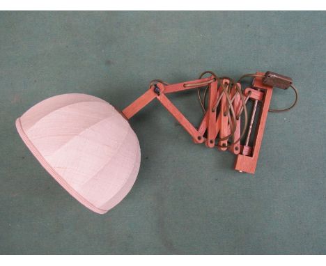 A flexible wooden wall lamp with cloth shade