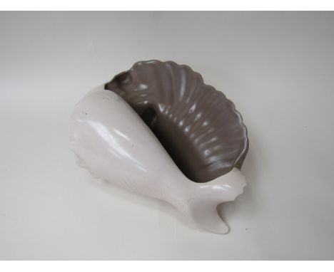 A brown and cream glazed Poole Pottery shell form