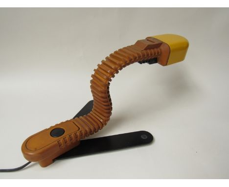 A Cobra desk lamp designed by Masayuki Kurosawa, flexible yellow ochre rubber neck and black metal stand