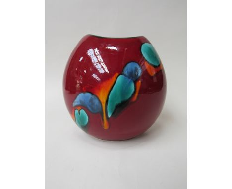 A Poole Odessey purse vase in red, blue and green. 18cm high 