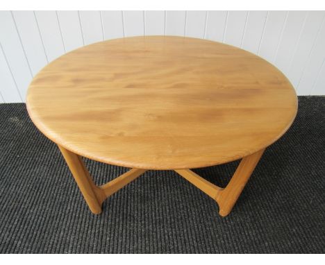 A circular Ercol elm and beech coffee table