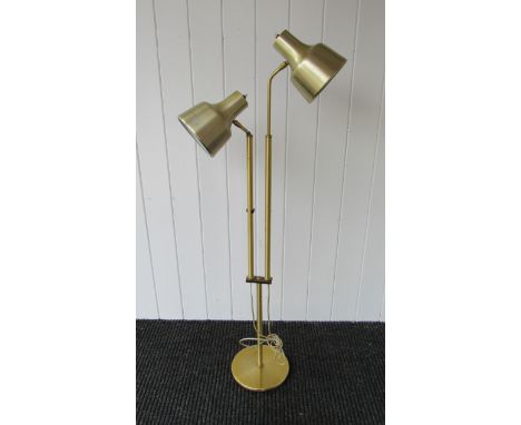 A brass standard lamp with twin adjustable spots 
