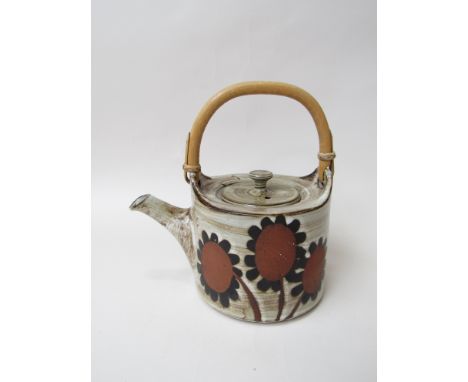 A Briglin Pottery teapot with cane handle. Impressed mark 