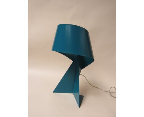 A Habitat ribbon lamp in teal colour 