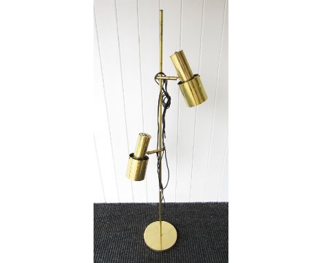 A brass standard lamp with twin adjustable spots 