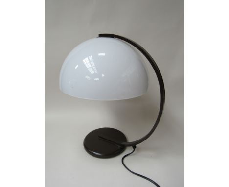 A metal Guzzini type table lamp with white shade