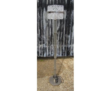 A textured glass and chromed metal standard lamp