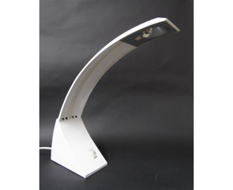 A white painted metal desk lamp of curving form
