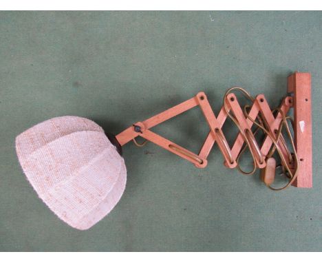 A flexible wooden wall lamp with cloth lampshade