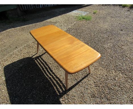 A light Ercol coffee table 