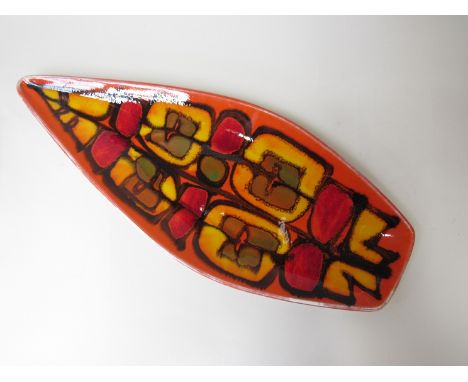 A spear shaped Poole Delphis plate in red, orange and yellow. Painted monogram to base, 43cm long