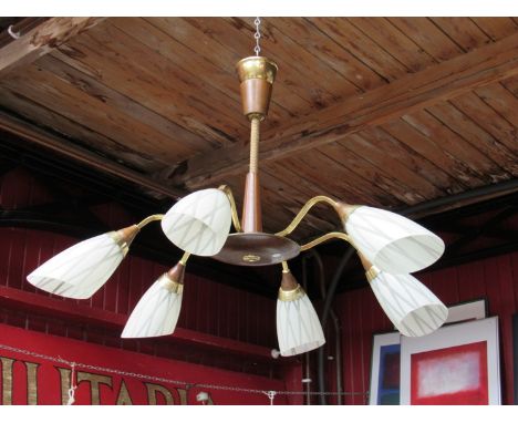 A six branch wood and brass ceiling light with linear patterned opaque glass shades