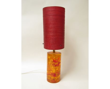 An orange shatterline lamp with red shade 