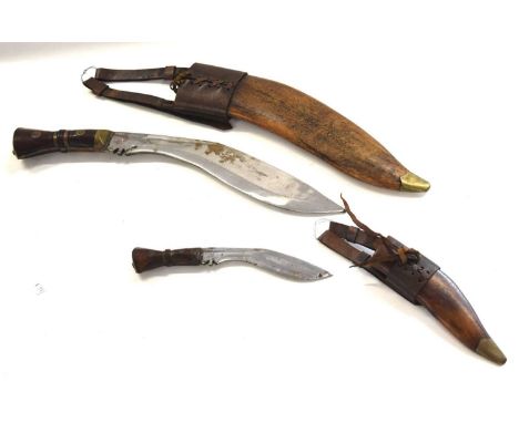 Two First World War British Army issue Kukri's 1917 dated consisting of one large and one small, in original leather scabbard