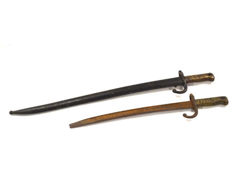 Two 19th Century French 1866 model sabre bayonet, one with metal scabbard stamped "Serial No 12136 to handguard" other lackin