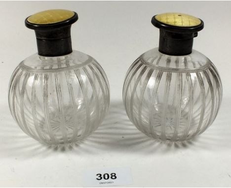 A pair of etched glass silver and enamel scent bottles, 11cm tall 