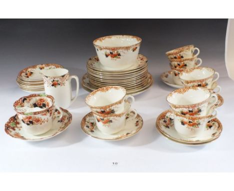 A Gladstone China tea service comprising: nine cups and saucers, twelve tea plates, two cake plates, milk and sugar 