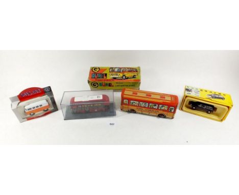 A Turkish Gurel tin plate bus with Vanguards Maroon Morris 1300 VA480012, a Lledo special edition 1955 VW camper and a scale 