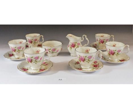 A Royal Albert 'Romance' tea set consisting six cups and saucers, sugar bowl and milk jug 