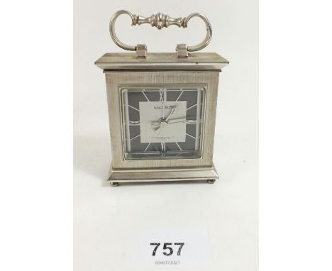 A vintage Luxor travel alarm clock retailed by Garrard and Co. London 