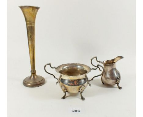 A silver  sugar basin and cream jug (jug a/f) 245g london 1910 and a silver vase 