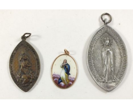 An enamel pendant painted The Madonna in yellow metal surround with text to verso, 3.cm x 2.5cm and two metal Madonna pendant