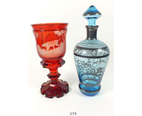 A Bohemian red flashed glass vase with engraved dog, 20cm and a blue silvered glass liquor decanter 