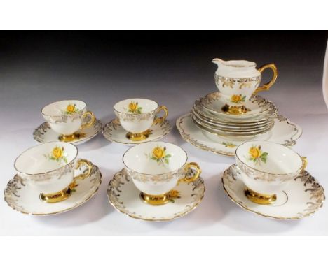 A Rosina vintage tea service printed roses comprising: five cups and six saucers, jug, sugar, six tea plates and cake plate 