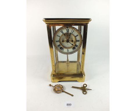 An Ansonia four glass mantel clock with visible escapement and paste surround, 27cm 