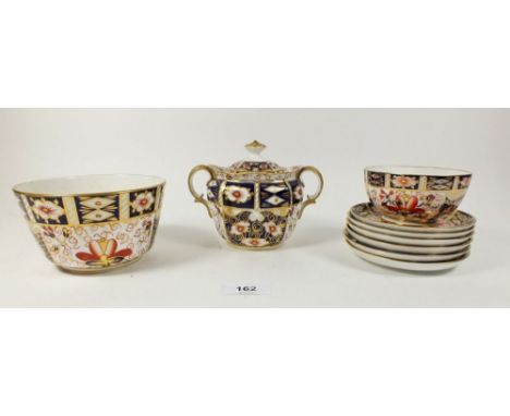 A group of Royal Crown Derby Imari tea ware pattern No. 2451 including covered sugar, sugar bowl, slop bowl and six small sau