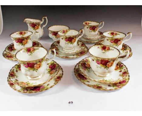 A Royal Albert Country Roses tea service comprising: six cups and saucers, six tea plats, milk and sugar 