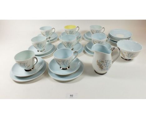 A vintage Queen Anne tea service 'Glade' comprising: seven cups, twelve saucers, twelve tea plates, jug and sugar 