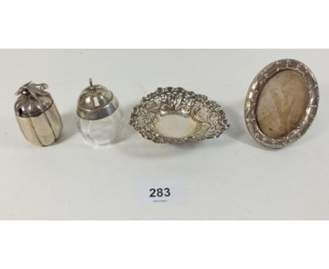 A silver heart form pierced trinket dish Birmingham 1876, a glass and silver miniature apple sauce pot and another cruet pot 