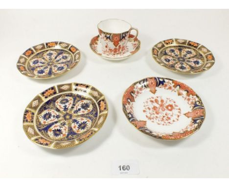 A Royal Crown Derby Imari trio No. 2712 and three similar saucers No. 1128 