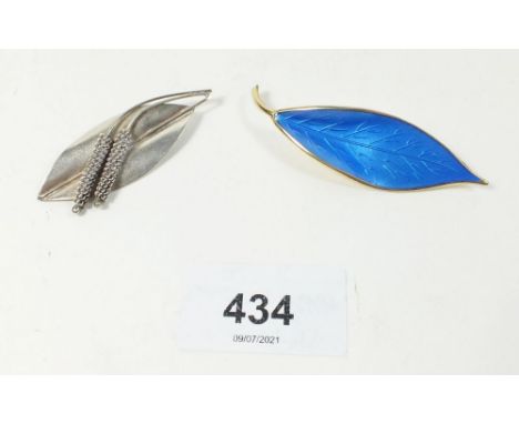 A Norwegian blue enamel leaf brooch and another metal leaf brooch 